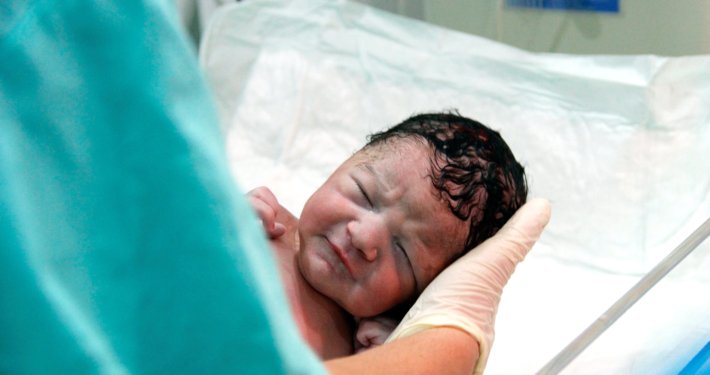 An image of a newborn baby in hospital