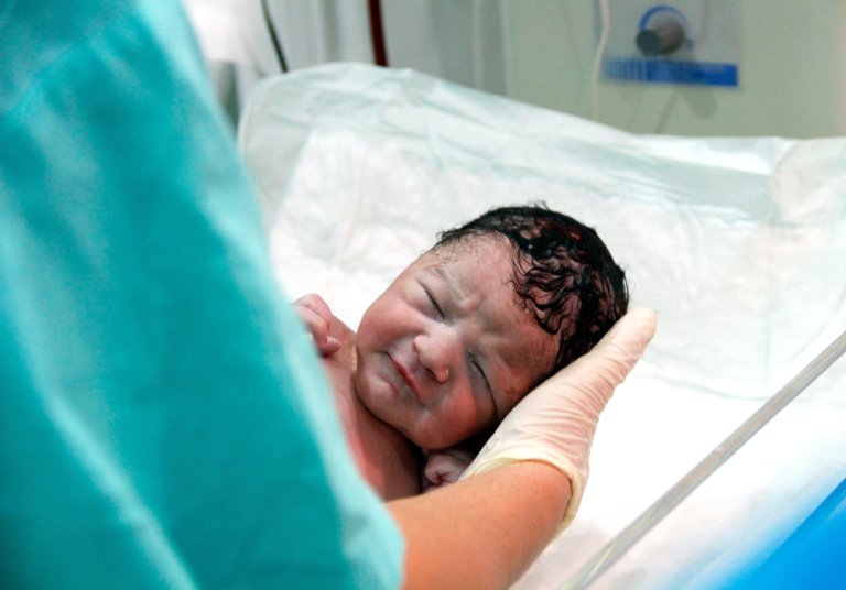 An image of a newborn baby in hospital