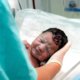 An image of a newborn baby in hospital